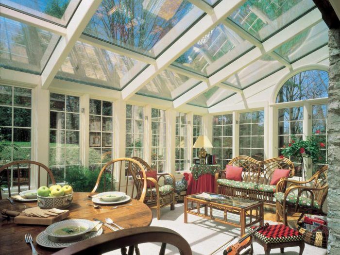 A sunroom with furniture.