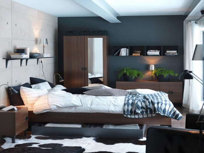 A black and white bedroom with a denim blue cowhide rug.