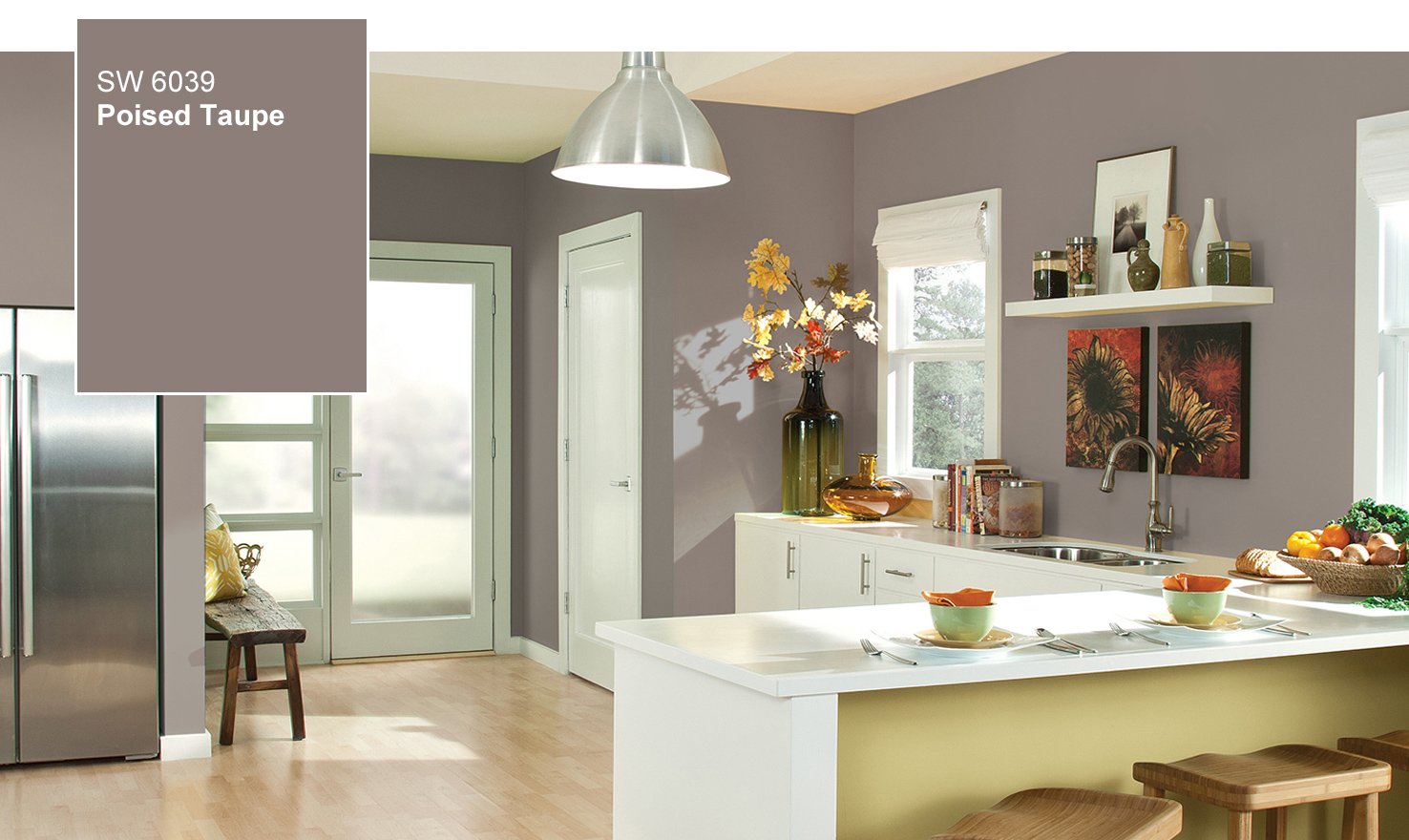 A kitchen with poised taupe walls and a white refrigerator.