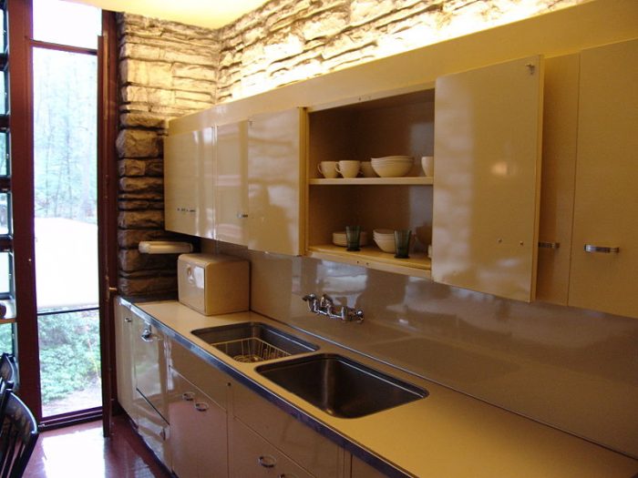 A kitchen with a window designed by Frank Lloyd Wright.