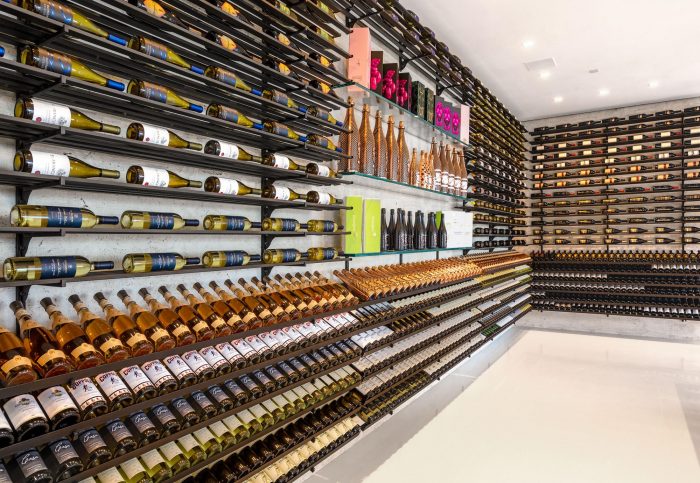 A luxurious wine cellar on 924 Bel Air Rd, filled with many bottles of wine.