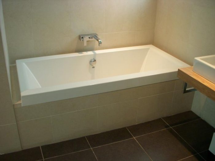 Narrow soaking tub for a smaller bathroom.