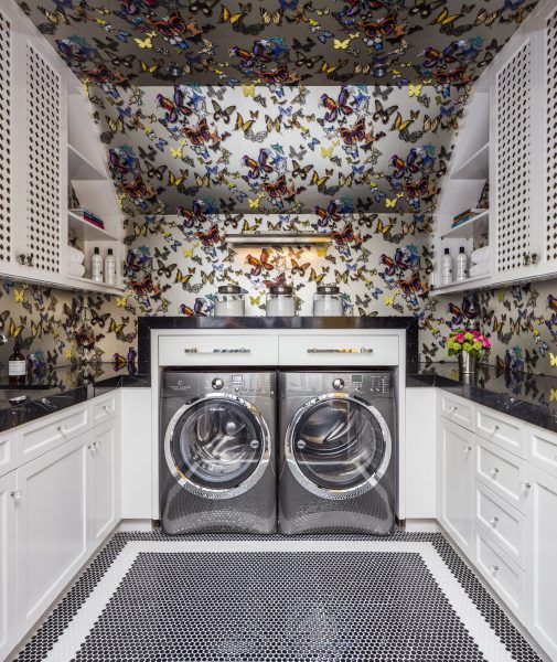 A laundry room featuring floral wallpaper, reflecting 2017 interior trends.