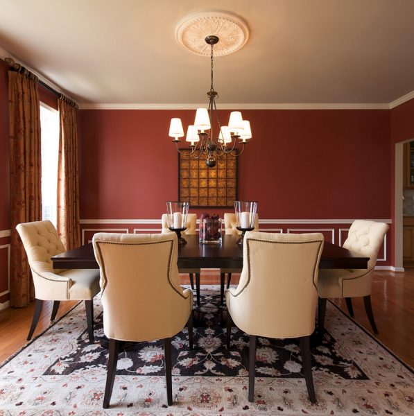 Barn red walls suit this transitional dining room