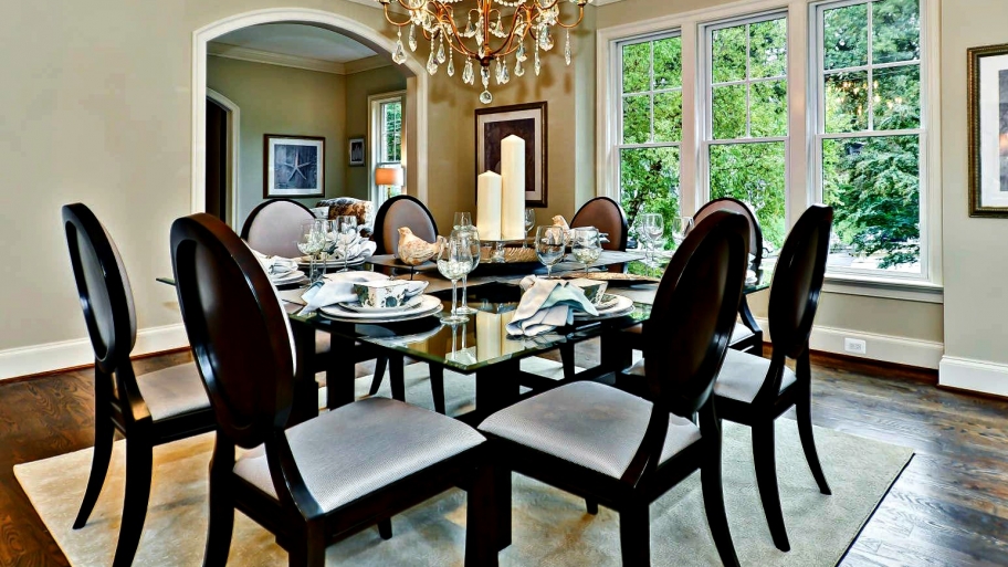 Stage your home with a formal dining room featuring a chandelier.