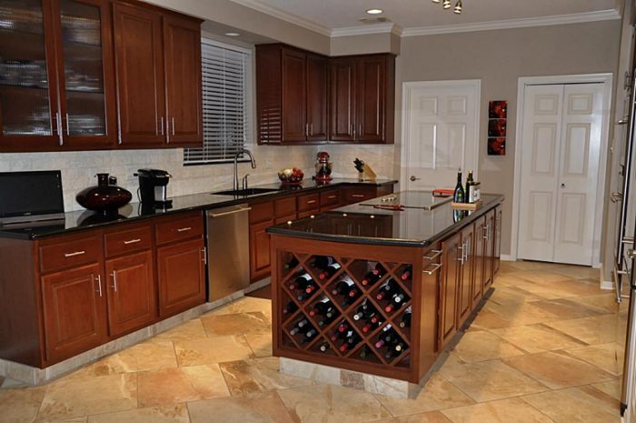 A kitchen with a wine rack and a kitchen island.