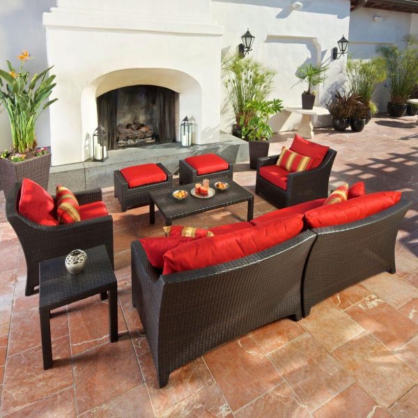 A patio entertaining set with red cushions.