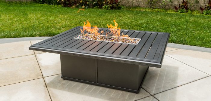 A black fire pit for entertaining on a patio.
