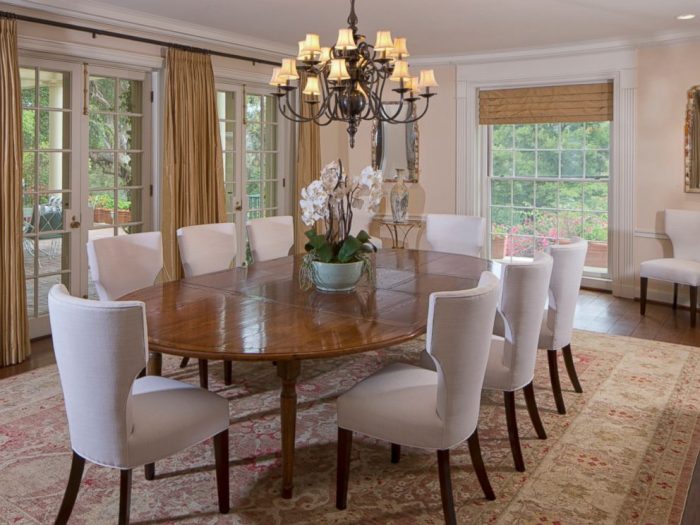 Taylor Swift's formal dining room, complete with a large table and chairs.
