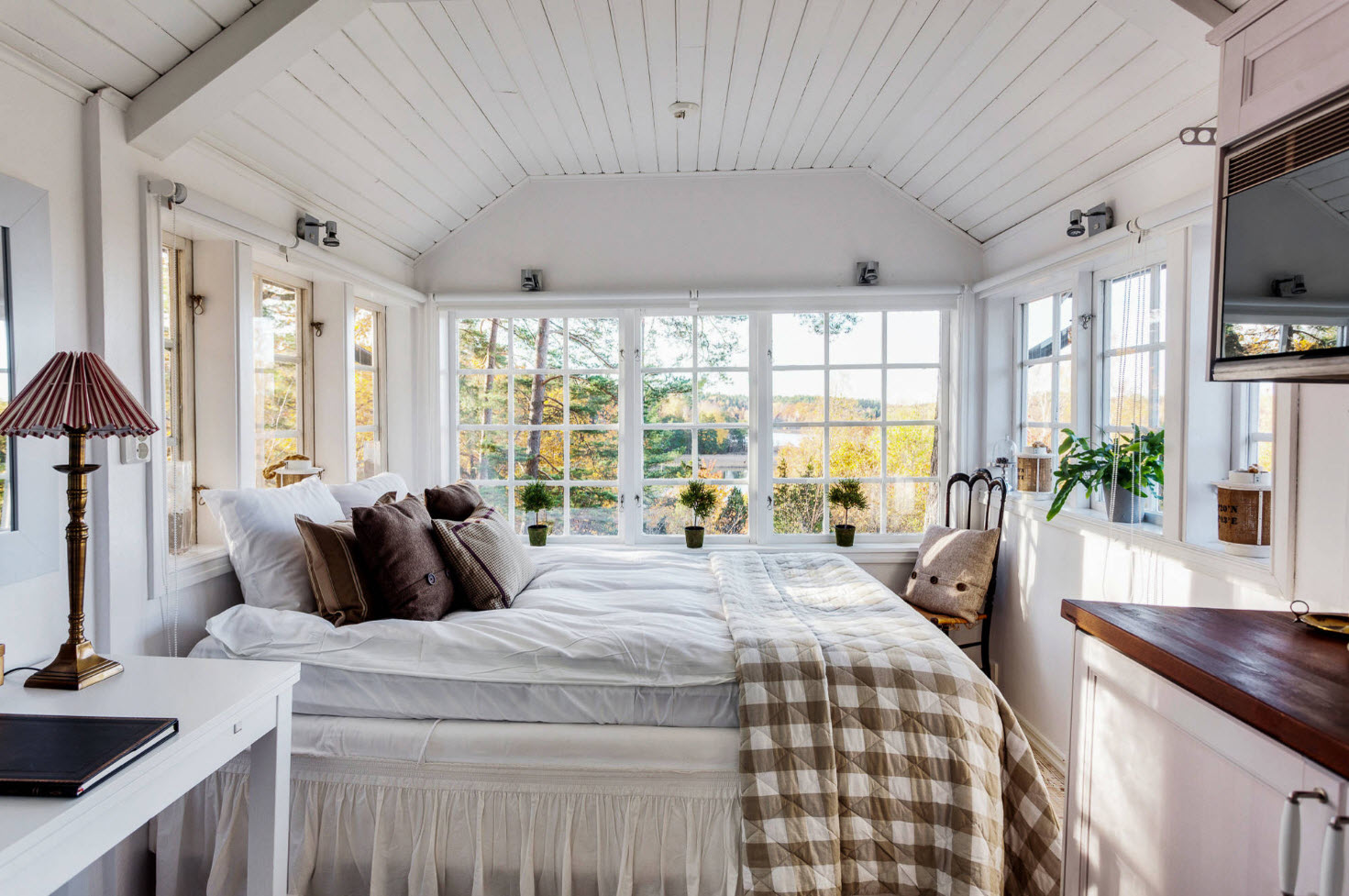 A pleasingly rustic bedroom with farmhouse touches and a bed.