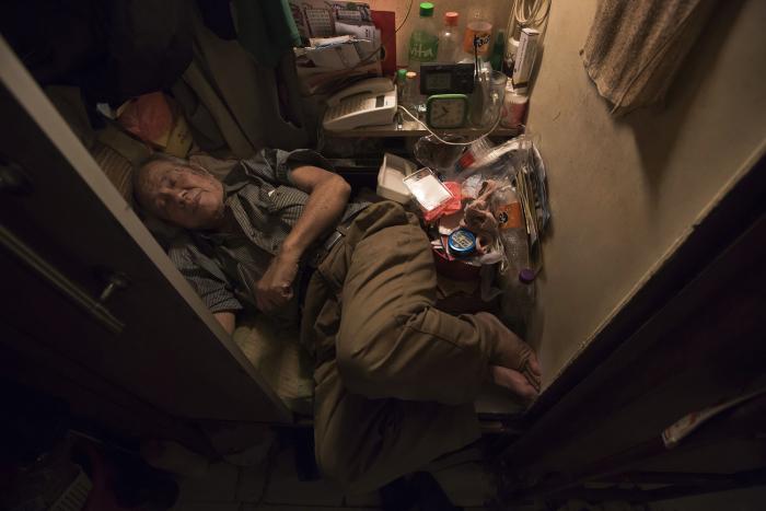A man living in a closet-sized space.