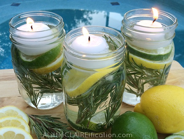 Three mason jars filled with lemons and limes, perfect for backyard cookout decor.