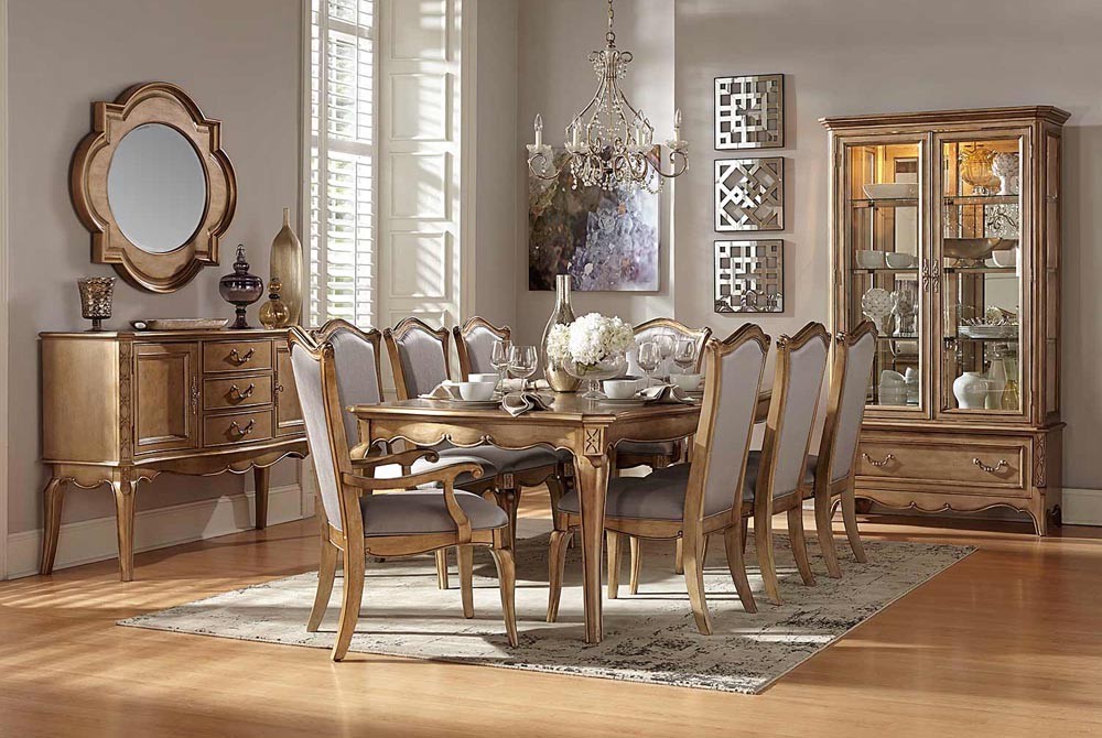 A dining room set decorated with gold accents.
