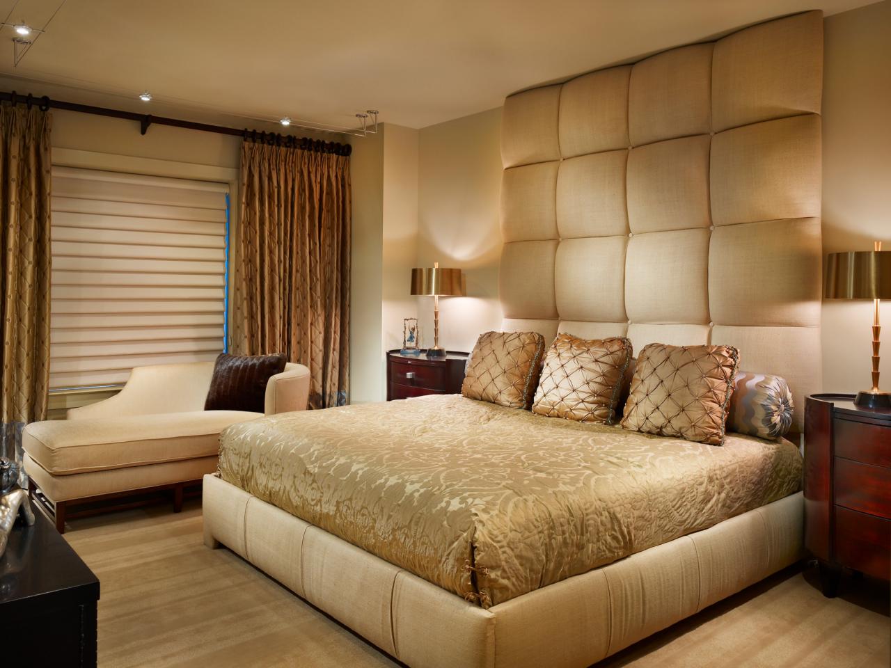 A beige bed adorned with gold accents.