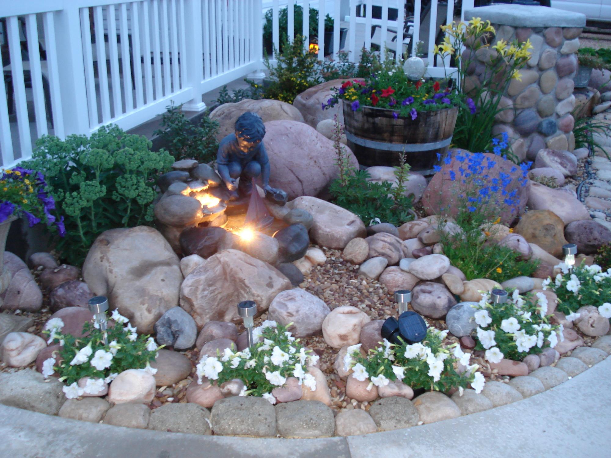 A rock garden featuring flowers.