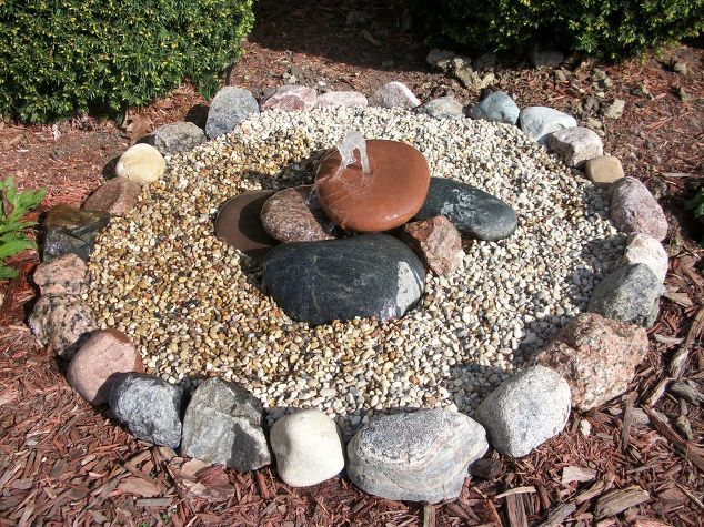A rock garden featuring a water fountain.