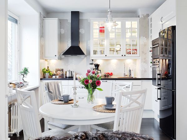 A Swedish kitchen with a dining table.
