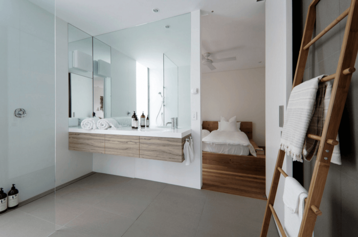 A modern bathroom with a mirror.