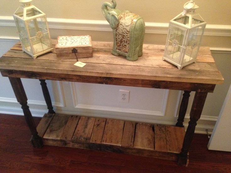A reclaimed wood console table made out of pallets.