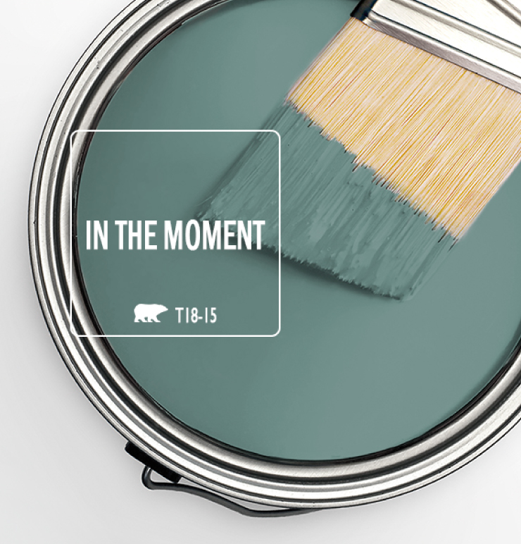 A can of paint with the words in the moment, available in classic paint colors.