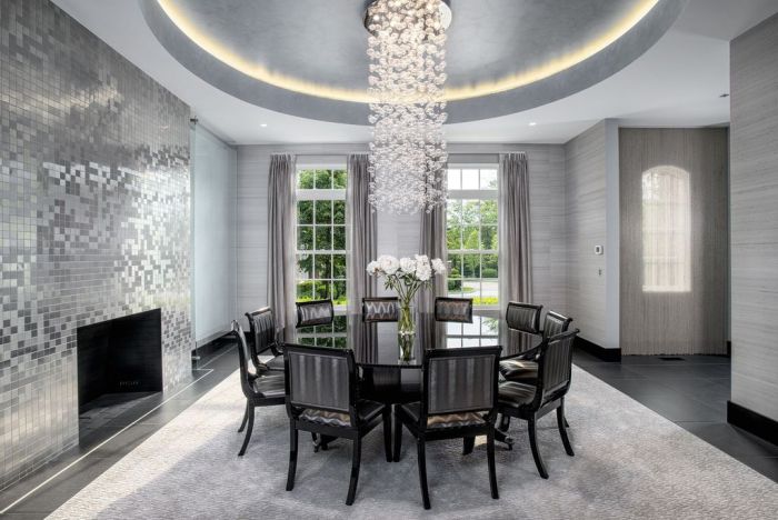 A contemporary dining room with a chandelier.