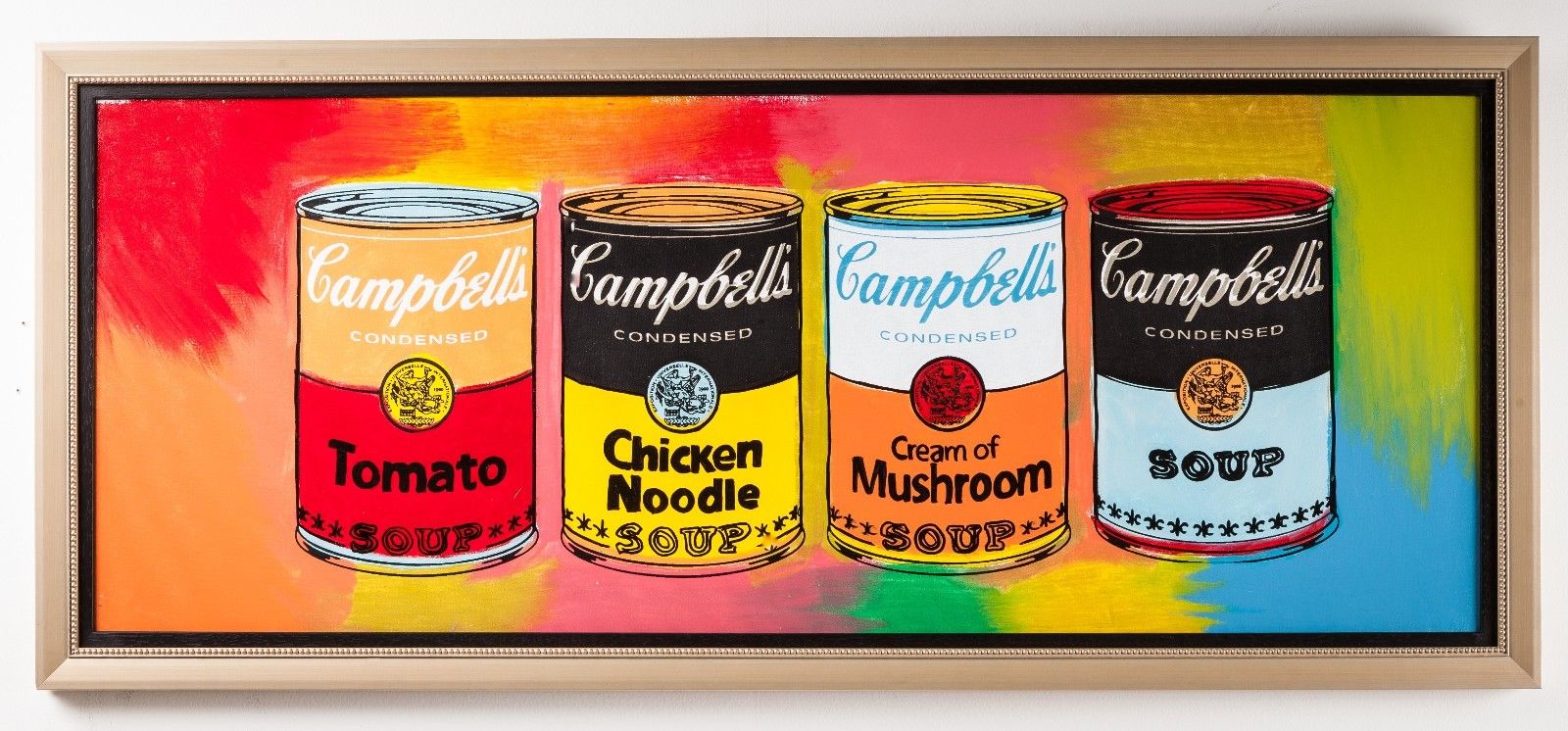 Campbell's cans of soup framed in a colorful frame, perfect for pop art kitchens.