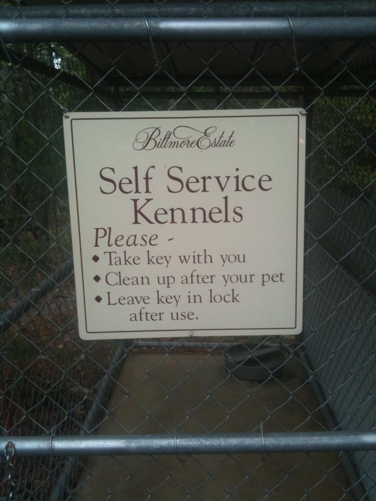 A dog-friendly sign promoting self-service kennels.