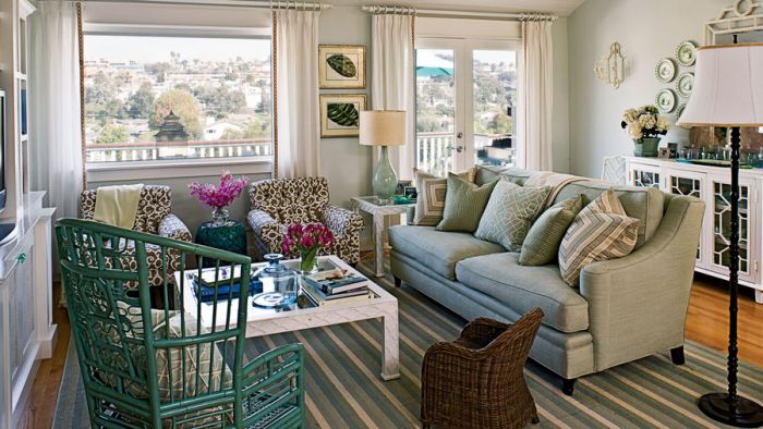 A beach cottage-style living room with a couch and chairs.