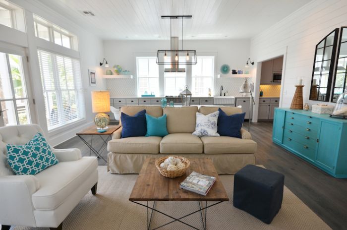 A living room with a beach cottage style couch and coffee table.
