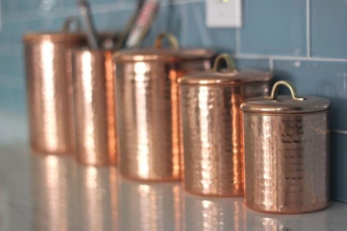 Copper canisters on a kitchen counter.