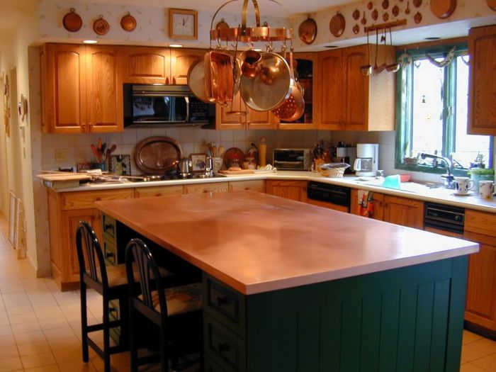 A copper kitchen with a counter top.