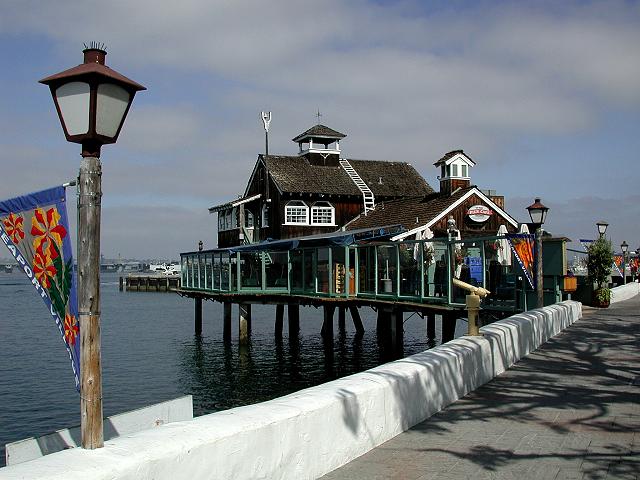 A dog-friendly vacation destination with a house on a pier.