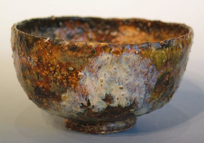 A wabi sabi-style bowl with a brown glaze on it.