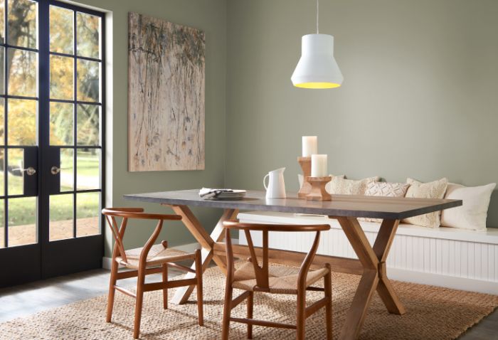 A dining room with a wabi sabi wooden table and chairs.