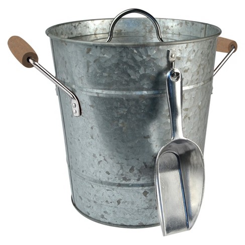 A metal ice bucket with a spatula and shovel.
