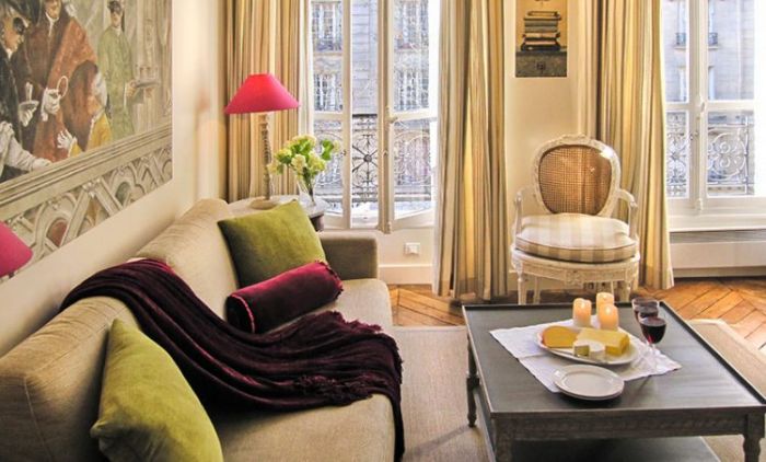 A Paris apartment with a couch and a coffee table.