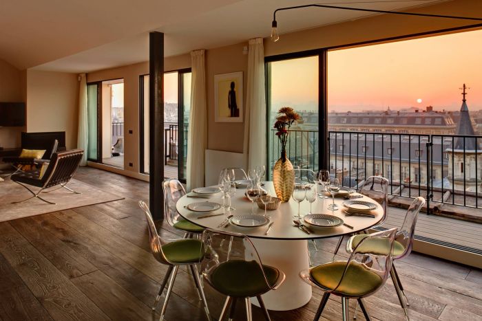 A Parisian apartment with a stunning city view from the dining room.