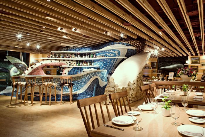 A centerpiece tile wall gives this restaurant interest (Decosee.com)