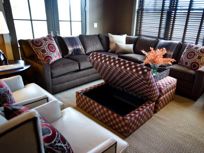 Designer tips for a living room with a brown couch and ottoman.
