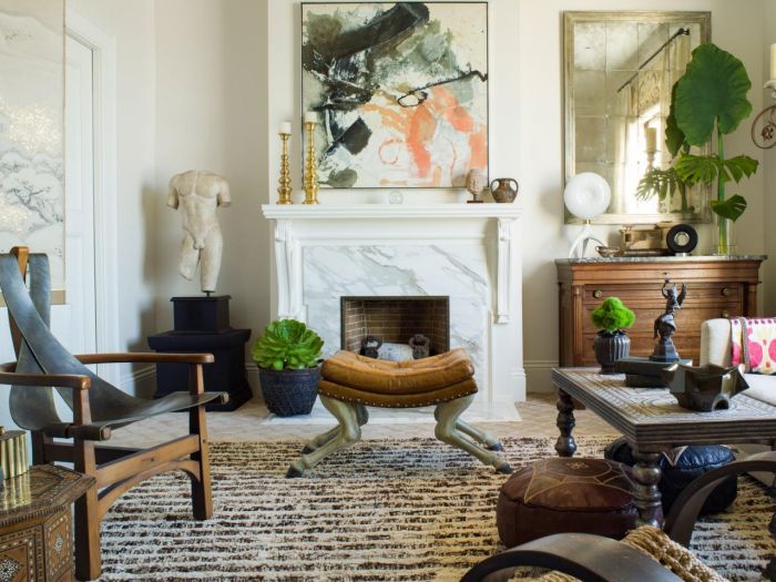 Designer tips for a cozy living room featuring a fireplace and chairs.