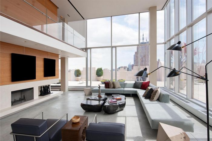 A loft with large windows overlooking the city.