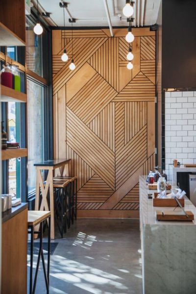 A restaurant with wood accent wall.