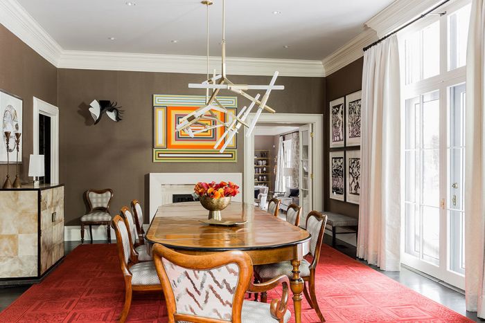 Designer tips for a dining room with a red rug.