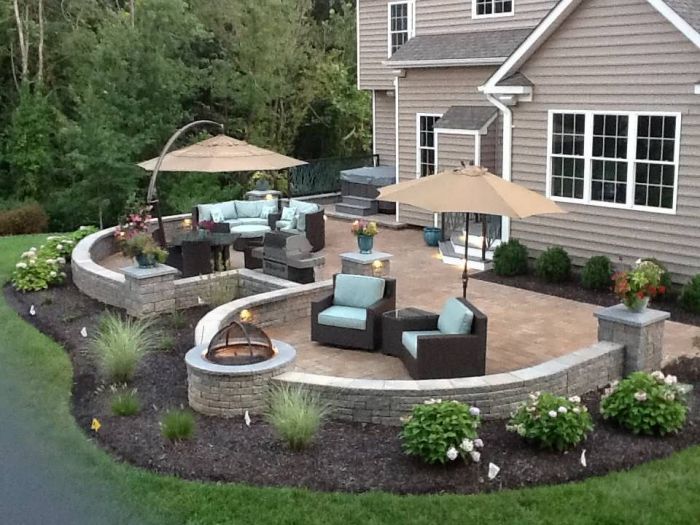 A backyard with patio furniture.