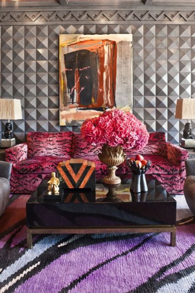 Designer tips for a living room with purple couches and a zebra print rug.
