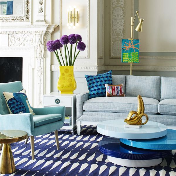 Designer tips for a living room featuring a blue couch and rug.