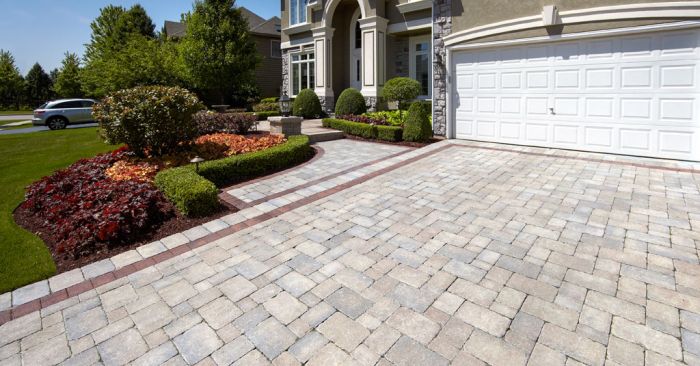 Curb Appeal Ideas: A driveway with brick pavers and landscaping.