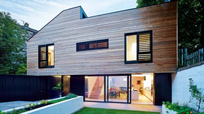 A modern house with wooden exterior cladding.