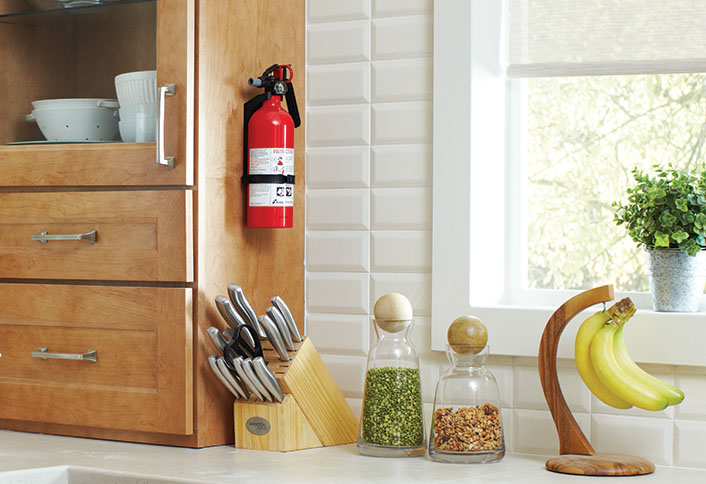 A home safety fire extinguisher in a kitchen.