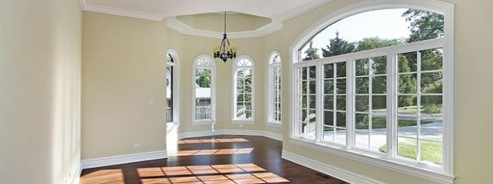 Curb Appeal Ideas: A hallway with arched windows and hardwood floors.